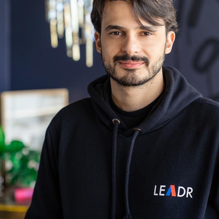 Ava Singh, Lead Design Curator at Canvas Wharf Ridge, reviewing corporate floral arrangements